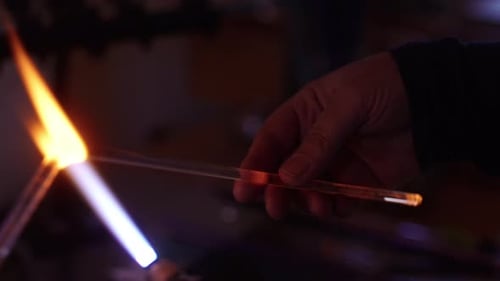 Crafting glass art using traditional techniques in a workshop
