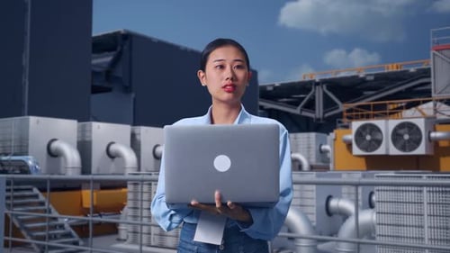 Asia Female Worker Use Laptop And Looking Around On Rooftop HVAC