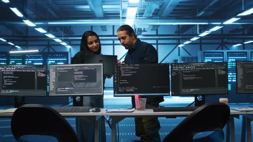 Multiracial Colleagues in Server Hub Workspace Collaborating to Fix Servers