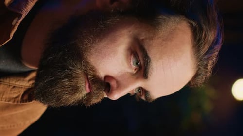 Thoughtful Man Taking a Drink in Close Up