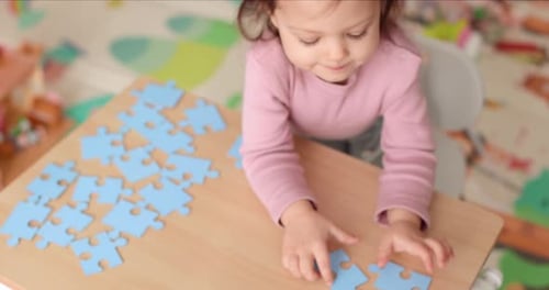 Child Girl Doing Puzzle at Home Children Development