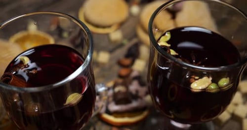 Spiced mulled wine with winter treats close up