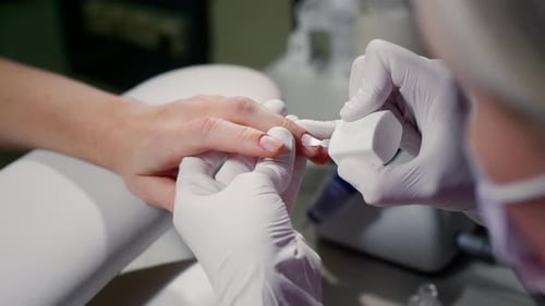 Manicurist Paints the Client's Nails with a Colorless Transparent Varnish Woman Takes Care Manicure