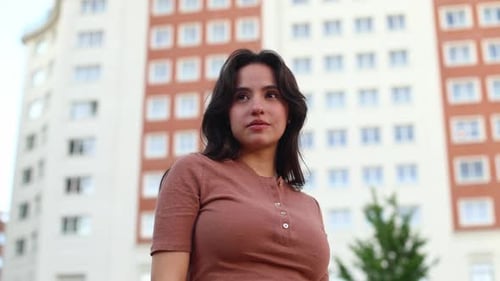 Smiling Woman Outside in an Urban Setting