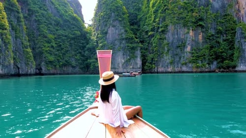 Pileh Lagoon with Green Emerald Ocean at Koh Phi Phi Thailand Women in Front of Longtail Boat