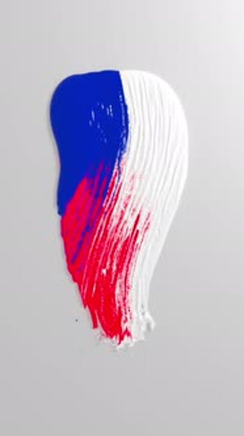 Glossy tricolor paint stroke on gray