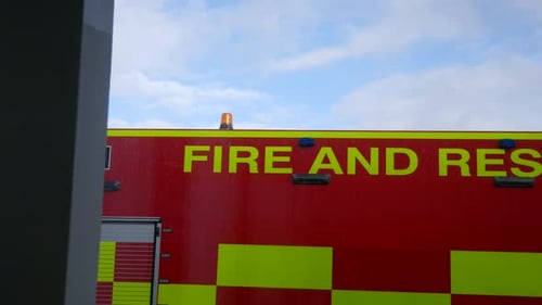 A fire and rescue truck outside of a window