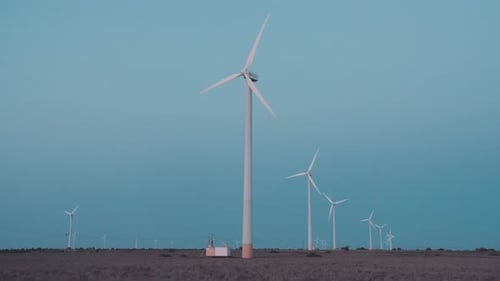 Wind Turbines Rotating in Rural Landscape