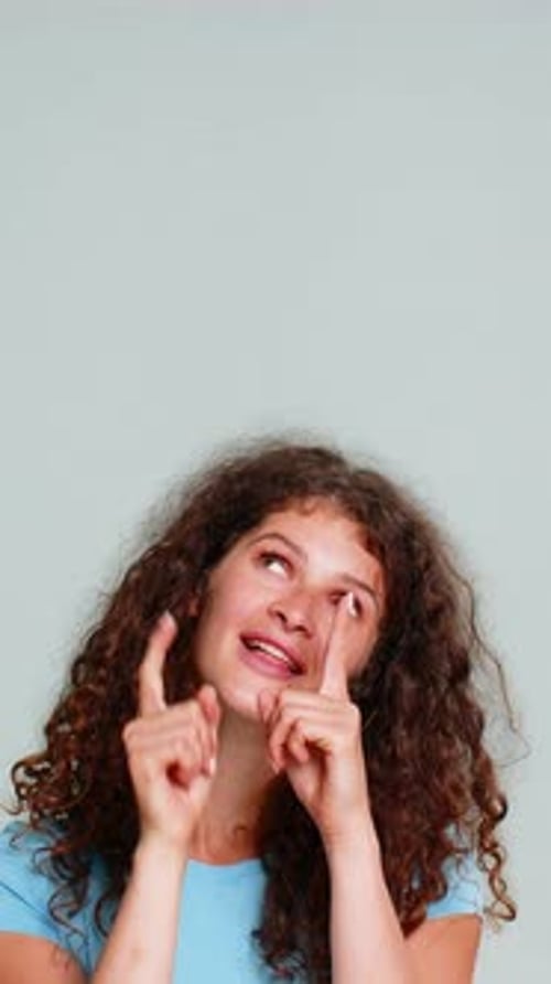 Woman Smiling Pointing Upward Presenting Advertising Promo Logo Product Copy Space Cheerful Gesture