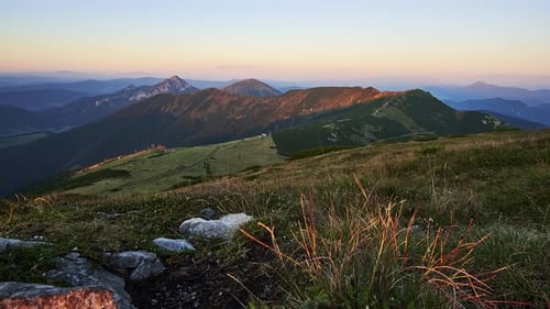 Light and Shadow of the Setting Sun Illuminate a Mountain Ridge in the Carpathian Mountains