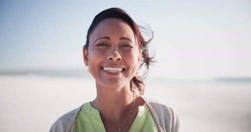 Beach, holiday and face of mature woman on vacation to relax in summer with nature