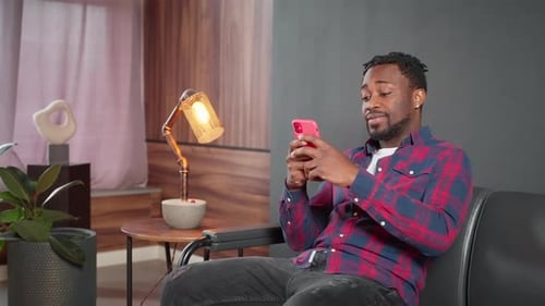 Upset African American Man Hipster Reading Message on Smartphone
