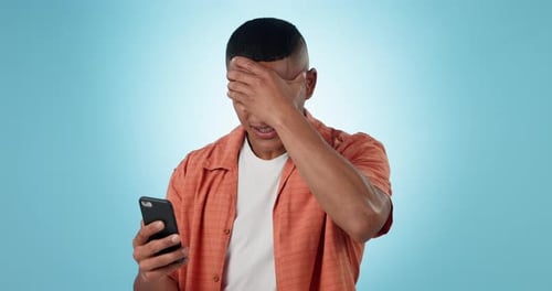 Man, fail and phone in studio with results, bad news or stress for glitch