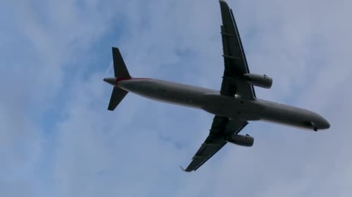 Jet airliner landing on runway.