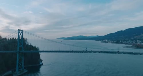Drone aerial footage flying around Lions Gate Bridge in Vancouver, British Columbia, ending with a