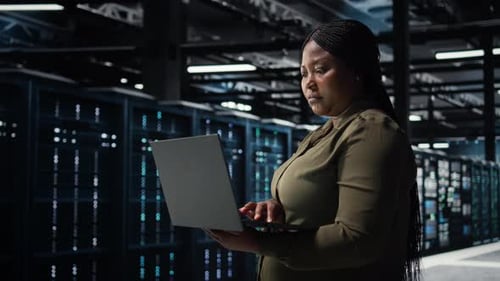 Software Developer in Data Center Using Laptop to Upgrade Systems