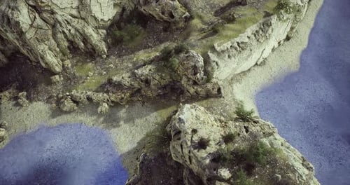 Majestic Rock Formations Overlooking Serene Blue Waters in a Natural Landscape