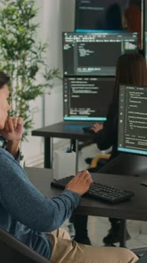 Vertical Video Asian Software Engineer Working on Security Program with Server Code