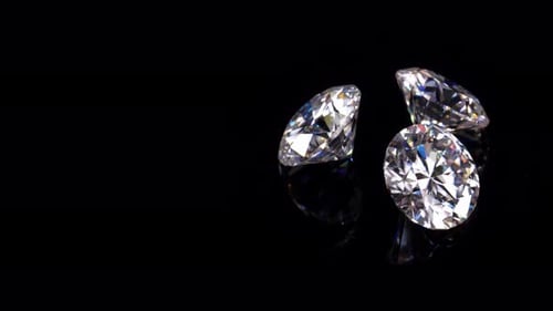 Glistening Diamonds Refract Light on Black Background