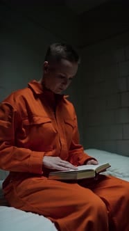 Female Inmate Reading Holy Bible and Praying in Prison, People Stock ...