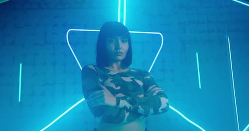 Cyberpunk Lady Looks Into Camera Emotionlessly in Neon Light