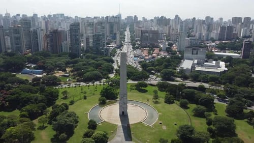 Obelisk of São Paulo Brazil, bustling traffic and city skyline, aerial pedestal
