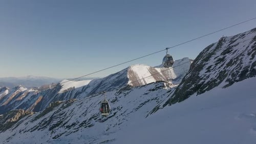 Cable Car On Ski Slope Of Mountain