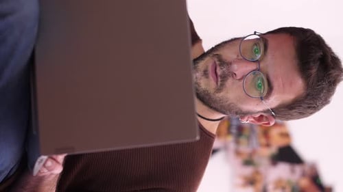 Man Working on Laptop Computer Close-Up Portrait