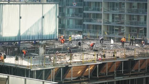 Construction site workers building skyscraper