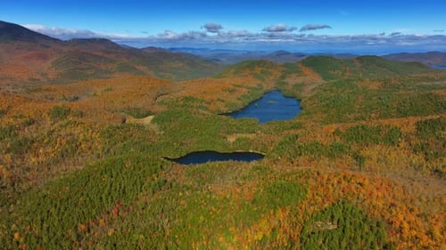 Stunning view of the blue lakes locating among the rocks covered with thick woods.