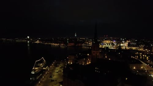 Beautiful aerial shot of illuminated buildings in the city at night