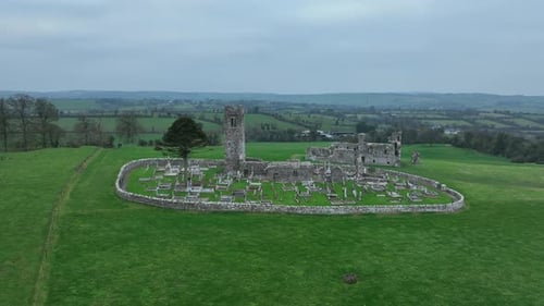 Hill of Slane, County Meath, Ireland, January 2022. Drone pushes north towards the ruined friary chu