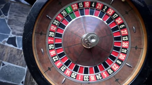 A Closeup View of an Antique Roulette Wheel Spinning Revealing the Thrill of Gambling in a Bygone