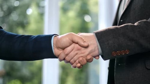 Two Business Man in Suit Shaking Hands at Office Formal Meeting Greeting Partnership Teamwork