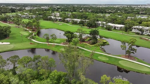 Florida country club golf course. Aerial establishing shot.