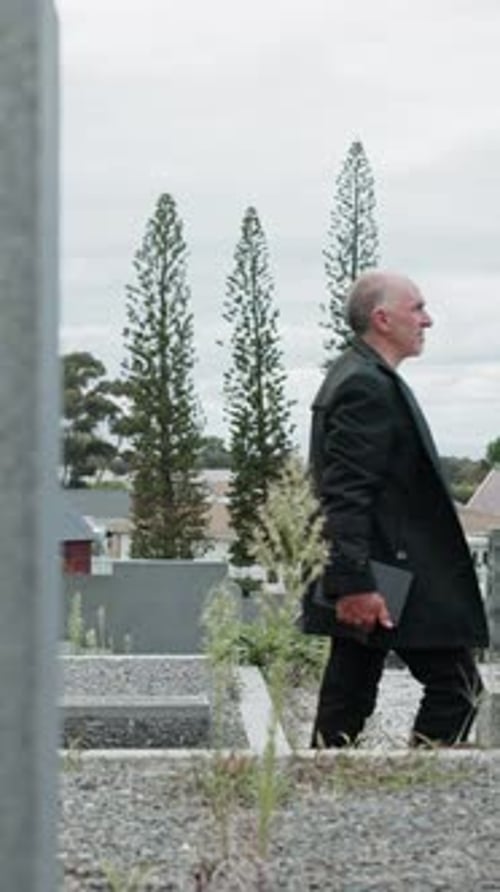 Family, people and walking at cemetery for funeral procession, mourning and loss at ceremony
