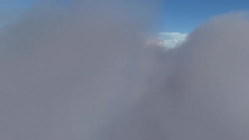 Aerial View of Fluffy Clouds Under Blue Sky