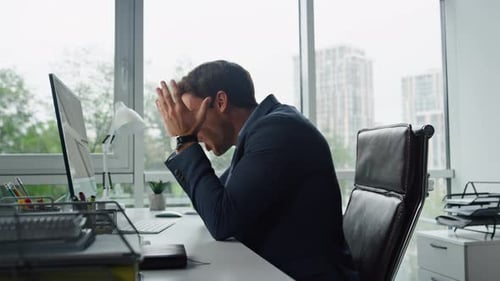 Angry Businessman Talking Computer at Workplace