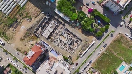 Aerial View Construction Site in Action Heavy Machinery and Workers Building