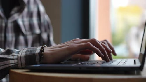 Closeup Side View Male Caucasian Hands Typing in Slow Motion on Laptop Keyboard Indoors Closeup