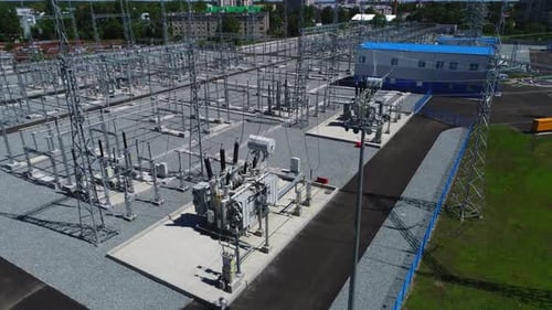 Power Transformers with Modern Gear and Building Aerial View