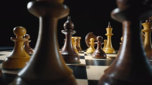 Chess Pieces on a Board with Black Background
