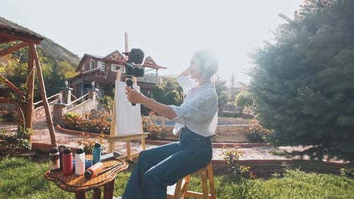 Young Woman Vlogging Her Art Outdoors