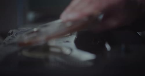 Hands Loading Film Reel onto Vintage Machine