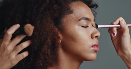 Woman Having Makeup Applied To Face