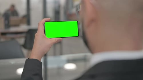 Holding Phone with Green Screen Chroma Key