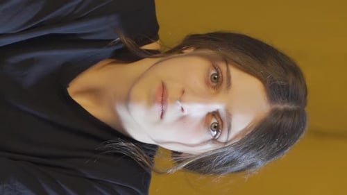Woman Stares Intensely at Camera, Close-Up