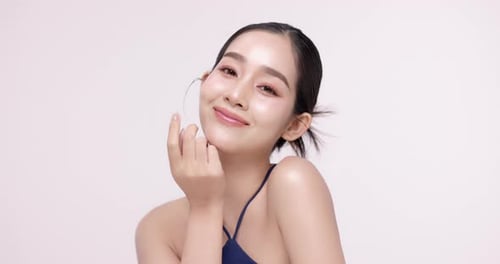 Slow motion of beautiful young Asian girl with k-beauty make up style.