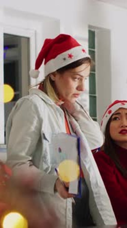 Vertical Video Director Delegating Tasks in Xmas Office
