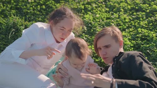 Parents Cherish Their Young Child Joyous Family Enjoying Outdoor Picnic Together Tender Parents